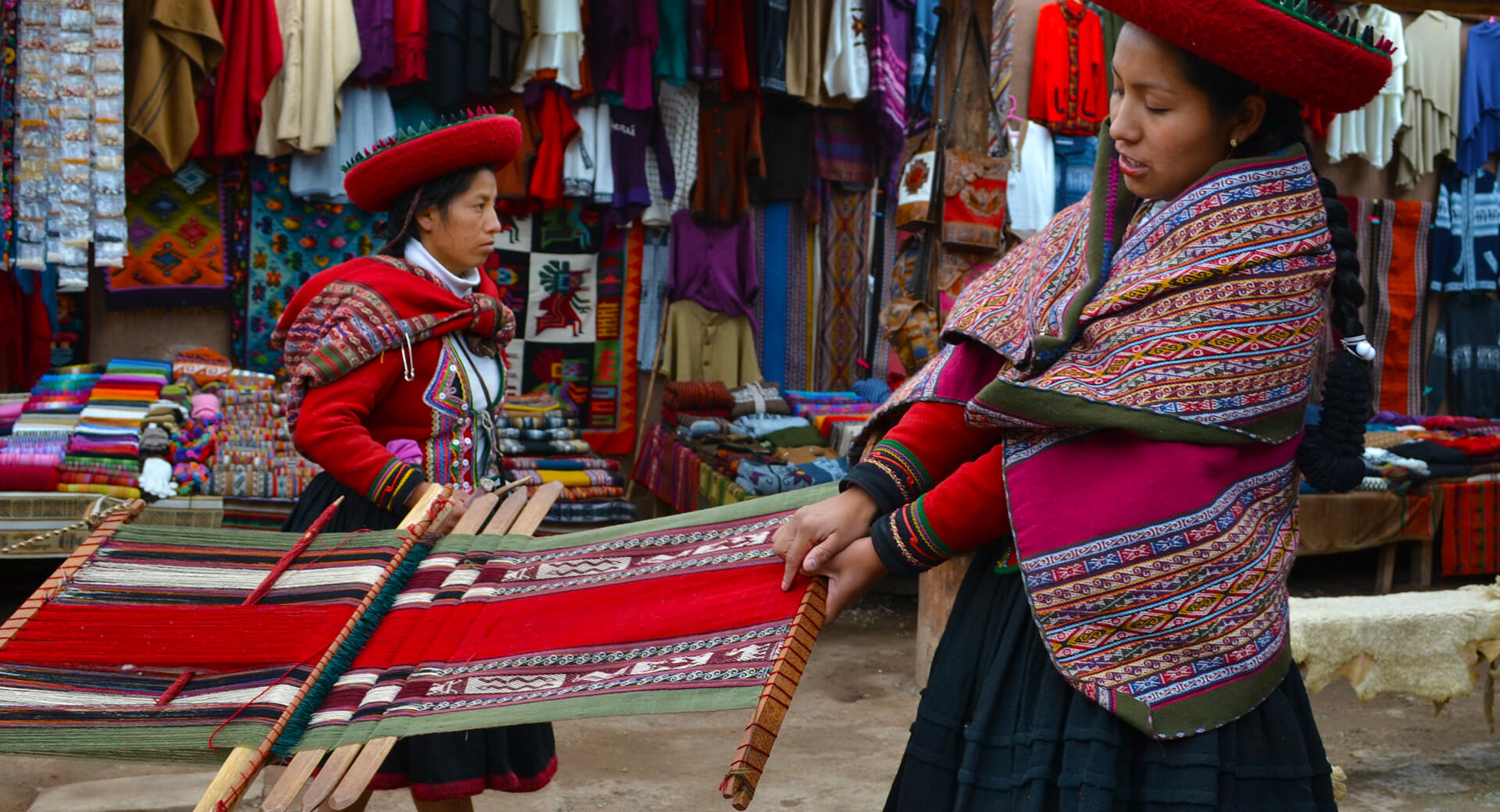 Andean women showing their weavings